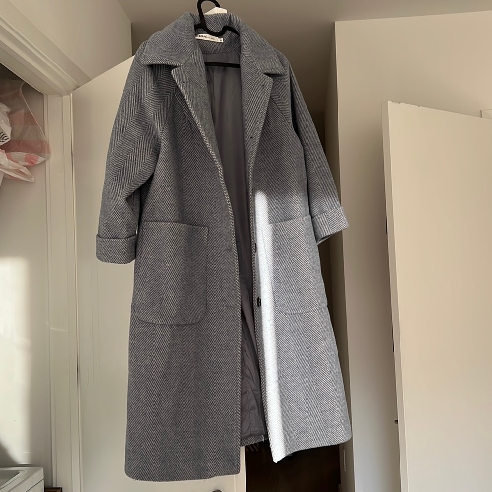 Light blue coat. Warm and 99% new. Very elegant